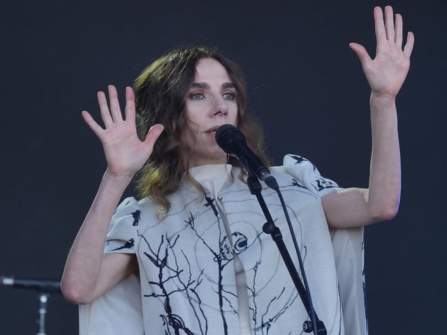 PJ Harvey performing on the Pyramid stage
