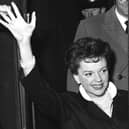 An emotional rendition of Have Yourself a Merry Little Christmas in a 1944 film by Judy Garland, pictured waving to onlookers at London's St Pancras Station in 1963, resonates strongly today as we face the Covid crisis but with hope for the future (Picture: PA)
