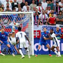 Jude Bellingham scores an overhead kick in the fifth minute of stoppage time to save England from a 1-0 defeat to Slovakia at Euro 2024. (Photo by Carl Recine/Getty Images)