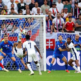 Jude Bellingham scores an overhead kick in the fifth minute of stoppage time to save England from a 1-0 defeat to Slovakia at Euro 2024. (Photo by Carl Recine/Getty Images)