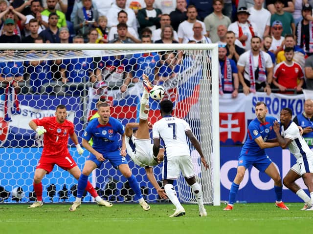 Jude Bellingham scores an overhead kick in the fifth minute of stoppage time to save England from a 1-0 defeat to Slovakia at Euro 2024. (Photo by Carl Recine/Getty Images)