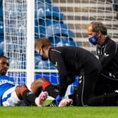 Jermain Defoe receives treatment for the suspected hamstring injury he sustained during Rangers' 4-0 friendly win over Motherwell at Ibrox on Wednesday night.