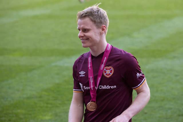 Hearts forward Gary Mackay-Steven with his Championship winner's medal.