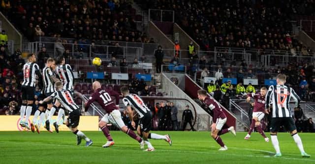 Hearts' Stephen Kingsley makes it 2-0 with a free kick during a cinch Premiership match between Heart of Midlothian and St Mirren at Tyncastle. (Photo by Ross Parker / SNS Group)