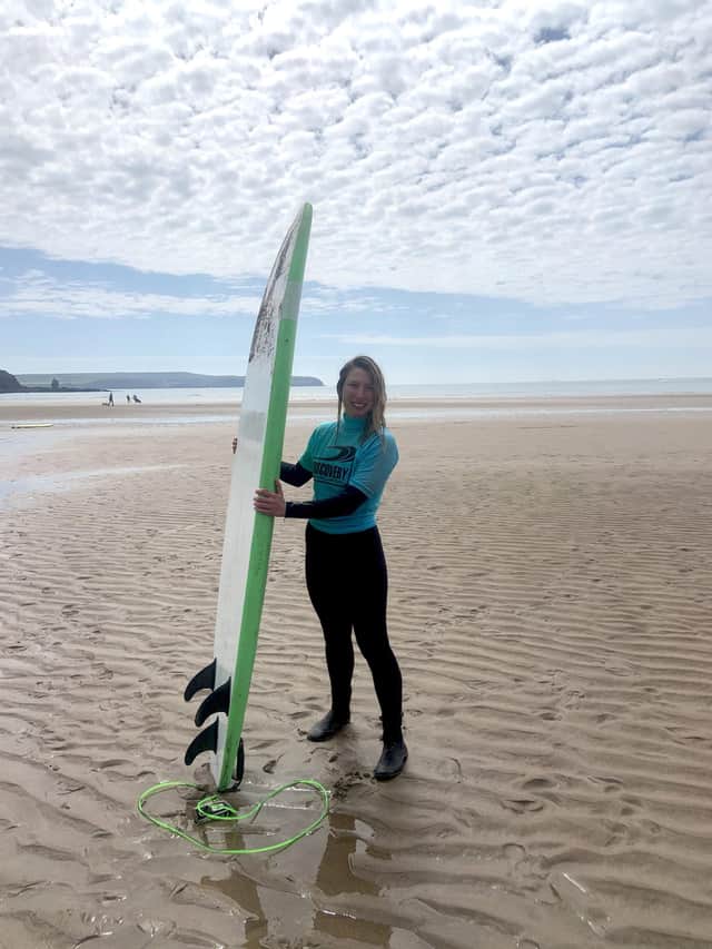 Emilia Harris takes a surfing lesson with Discovery Surf.