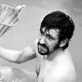 Rangers' John Greig celebrates with the European Cup Winners' Cup trophy in the bath in 1972.