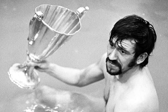 Rangers' John Greig celebrates with the European Cup Winners' Cup trophy in the bath in 1972.