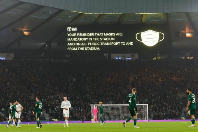 Fans at Hampden were reminded of covid-19 precautions on the big screens during the Premier Sports Cup Final. (Photo by Craig Williamson / SNS Group)