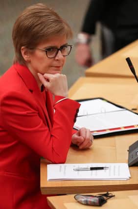 First Minister Nicola Sturgeon was quizzed over vaccine supply to GPs.