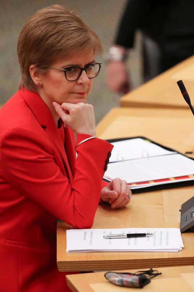 First Minister Nicola Sturgeon was quizzed over vaccine supply to GPs.