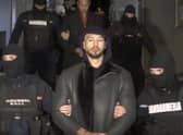 Social media influencer and former kickboxer Andrew Tate, who is being held in Romania on suspicion of organised crime and human trafficking, has arrived at an appeal court in Bucharest to challenge a decision to extend his detention by 30 days.