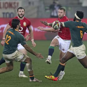 Finn Russell chips the ball through a gap in the South African defence during the Lions' defeat in the third Test. Picture: Halden Krog/AP