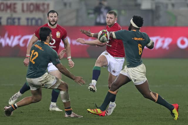 Finn Russell chips the ball through a gap in the South African defence during the Lions' defeat in the third Test. Picture: Halden Krog/AP