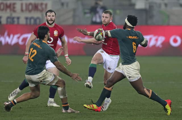 Finn Russell chips the ball through a gap in the South African defence during the Lions' defeat in the third Test. Picture: Halden Krog/AP