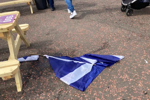 A saltire flag lies on the ground after the defeat (Photo: Hannah Brown).