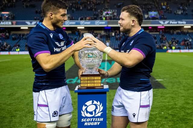 New caps Ewan Ashman, right, and Josh Bayliss get their hands on the Hopetoun Cup, the trophy awarded when Scotland play Australia. (Photo by Ross Parker / SNS Group)