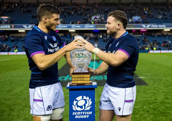 New caps Ewan Ashman, right, and Josh Bayliss get their hands on the Hopetoun Cup, the trophy awarded when Scotland play Australia. (Photo by Ross Parker / SNS Group)