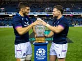 New caps Ewan Ashman, right, and Josh Bayliss get their hands on the Hopetoun Cup, the trophy awarded when Scotland play Australia. (Photo by Ross Parker / SNS Group)