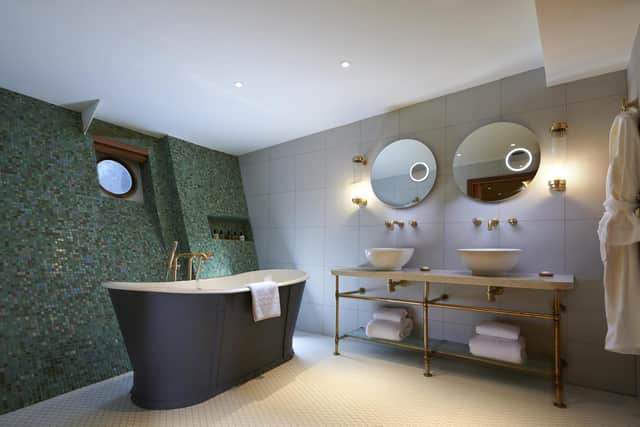 The bathrooms on Fingal have the wow factor, with glimmering tiles and fittings. Pic: Fiona Laing