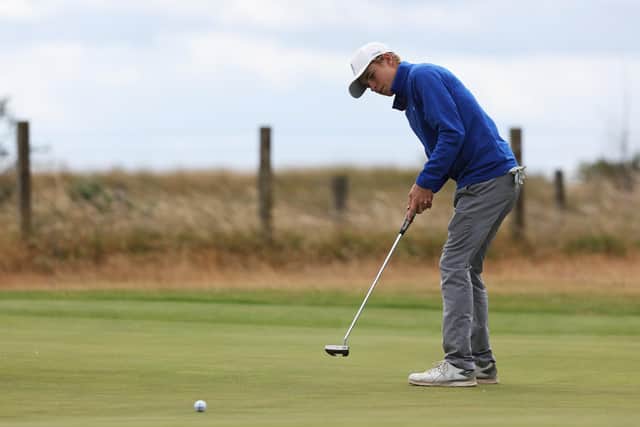 Connor Graham putts on the third green during the R&A Junior Open at Monifieth Golf Links. Picture: Matthew Lewis/R&A/R&A via Getty Images.