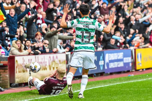 Celtic's Celtic's Yang Hyun-jun pleads his innocence after fouling Hearts' Alex Cochrane - he was later sent off.