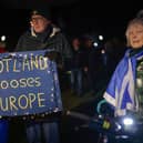 Anti-Brexit campaigners take part in a torchlight procession to the Scottish Parliament on the third anniversary of Brexit in January 2023 (Picture: Jeff J Mitchell/Getty Images)
