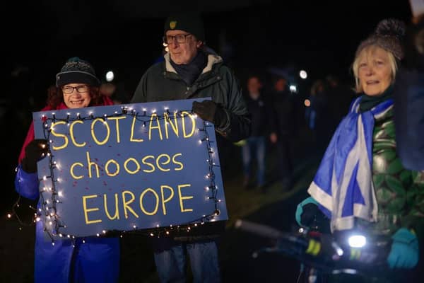 Anti-Brexit campaigners take part in a torchlight procession to the Scottish Parliament on the third anniversary of Brexit in January 2023 (Picture: Jeff J Mitchell/Getty Images)