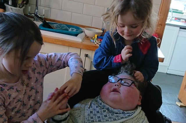 Benjamin with his two sisters