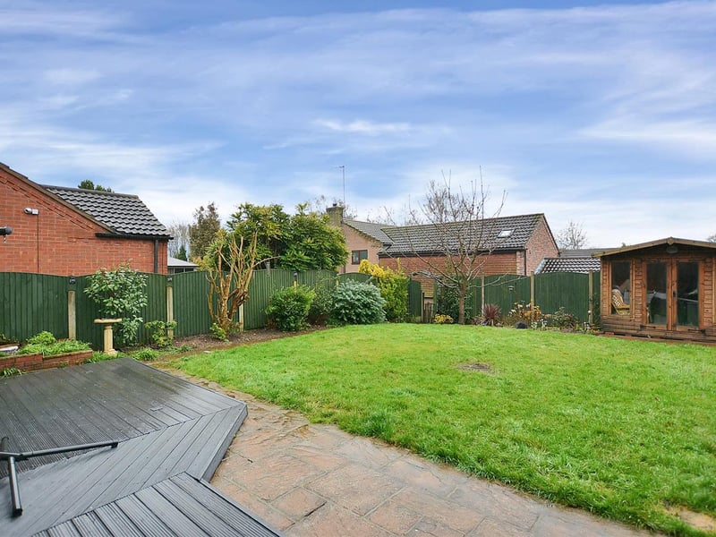 The rear garden is mainly laid to lawn and features ample seating areas and a summerhouse