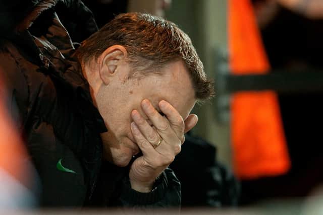 Tony Mowbray can't bear to look during the 4-0 defeat to St Mirren that cost him the Celtic job and provided him a desperate record that has no comparison with what has befallen Neil Lennon this term. (Photo by Steve Welsh/SNS Group)