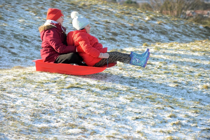 Erin Kelly, six and Grace Lamb, nine, sledging on Cleadon Hills.