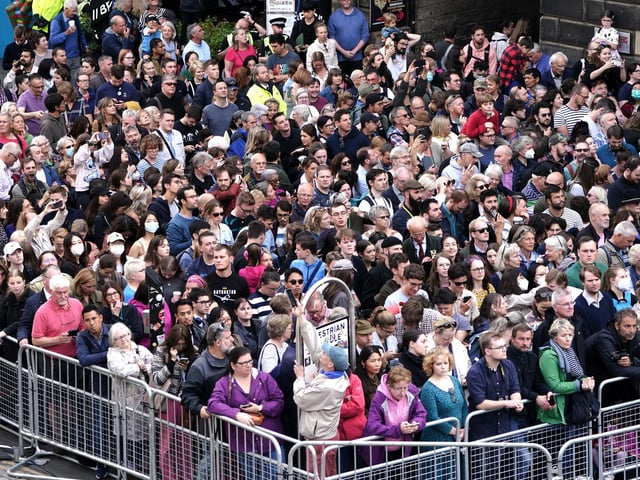 Members of the public during an Accession Proclamation Ceremony at Mercat Cross, Edinburgh, publicly proclaiming King Charles III as the new monarch. Picture date: Sunday September 11, 2022.