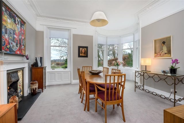 The dining room has a gas fire and a bow window in the turret providing a lovely view over the garden.