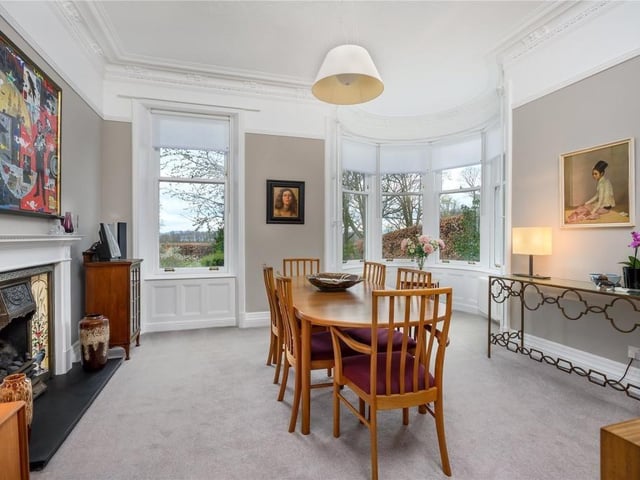 The dining room has a gas fire and a bow window in the turret providing a lovely view over the garden.