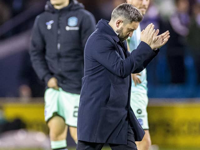 Hibs manager Lee Johnson cuts a dejected figure after the 1-0 defeat at Kilmarnock before t. (Photo by Roddy Scott / SNS Group)