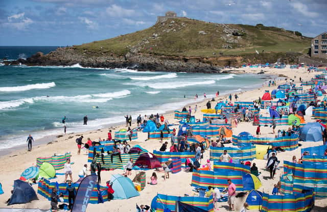 Holidaymakers enjoy the sunny weather at Porthmeor Beach in St Ives, Cornwall (Picture: Matt Cardy/Getty Images)