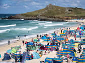 Holidaymakers enjoy the sunny weather at Porthmeor Beach in St Ives, Cornwall (Picture: Matt Cardy/Getty Images)