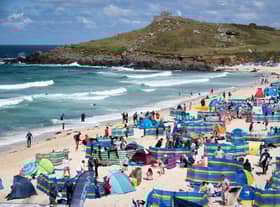 Holidaymakers enjoy the sunny weather at Porthmeor Beach in St Ives, Cornwall (Picture: Matt Cardy/Getty Images)