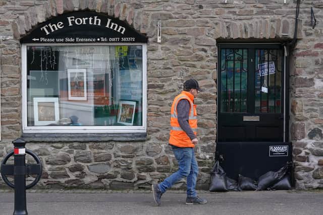 Sand bags sit in a doorway in Aberfoyle in Perthshire. Picture: Andrew Milligan/PA Wire