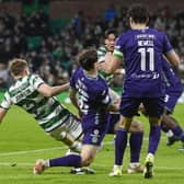 Celtic's Alistair Johnston is fouled by Hibs' Lewis Stevenson inside the box leading to a penalty after a VAR check. (Photo by Rob Casey / SNS Group)