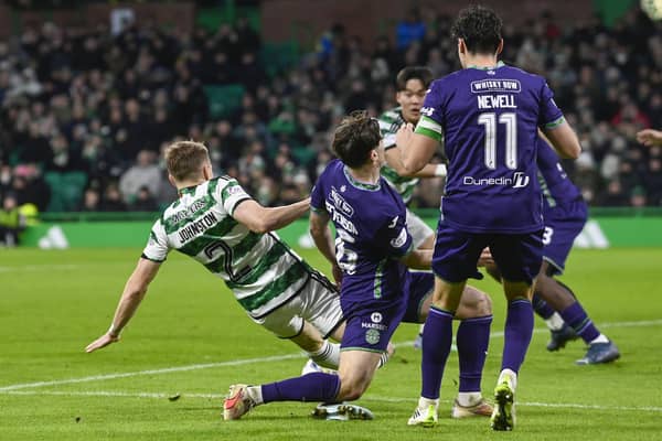 Celtic's Alistair Johnston is fouled by Hibs' Lewis Stevenson inside the box leading to a penalty after a VAR check. (Photo by Rob Casey / SNS Group)