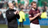 Hearts interim manager Steven Naismith and Nathaniel Atkinson applaud the fans at full time.