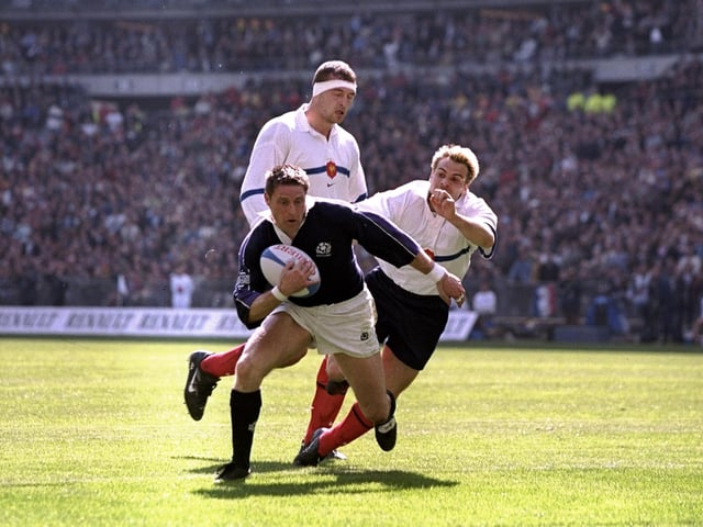 Alan Tait on his way to scoring his first try in the 36-22 win against France in 1999. The centre scored two in Paris that afternoon to cap an outstanding Five Nations campaign in which he combined expertly with Gregor Townsend and John Leslie in a highly creative Scotland midfield. Tait had also scored a try double in the narrow defeat by England and one in the opening win over Wales.