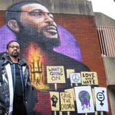 Artist Dreph with a 16ft mural he created in Brixton to celebrate the 50th anniversary of Marvin Gaye's album What's Going On (Picture: Matt Crossick/PA)