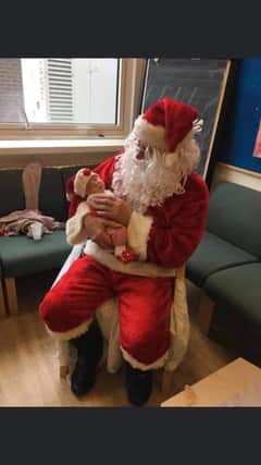 Caroline Procter posted this photo of her granddaughter on her first Christmas visiting Santa. She said 'she was born on August 10, one week early so she's only tiny on the photo.'