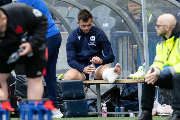 Scotland's Ben White looks dejected after he picked up an injury.