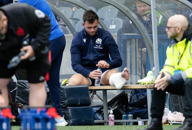 Scotland's Ben White looks dejected after he picked up an injury.