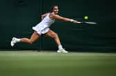 Jodie Burrage returns the ball to US player Caty McNally during her first round defeat at Wimbledon. (Photo by KIRILL KUDRYAVTSEV/AFP via Getty Images)