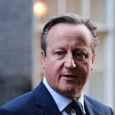 The UK's Foreign Secretary David Cameron leaves from 10 Downing Street after attending a cabinet meeting.