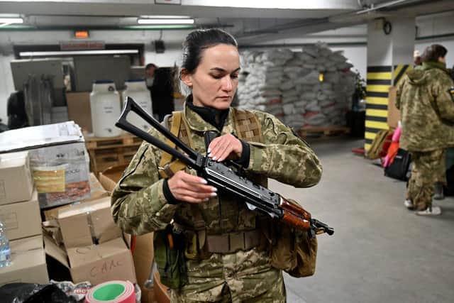 Iryna Sergeyeva, a volunteer, attends military training in an underground garage in Kyiv in March last year (Picture: Sergei Supinsky/AFP via Getty Images)